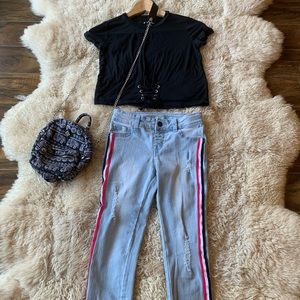 Selling a black T shirt and rip jean together.